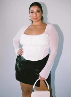 2025's Must-Have Fashion Pieces: Mini Skirts & Casual Tops That Define Your Style -Femme Flair 1 modelinfo Javi us14 370895b2 ada5 4f97 a912 ed16a6b33de2